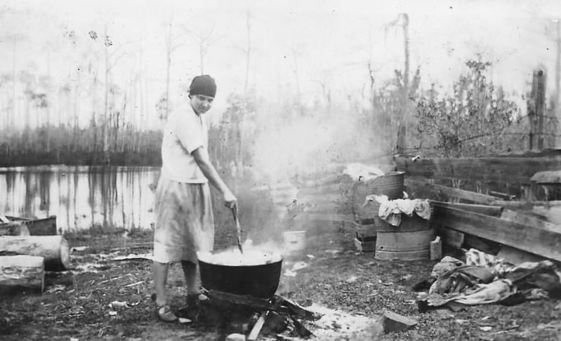 Finnish Immigrant Boiling Clothes for Wash, Near Bayou Cumbest, Mississippi. Around 1900