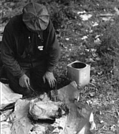 Great Depression: Man in hobo jungle killing turtle to make soup, Minneapolis, Minnesota. Photo by John Vachon. Courtesy Library of Congress, Prints & Photographs Division, FSA-OWI Collection LC-USF33- 001521-M3