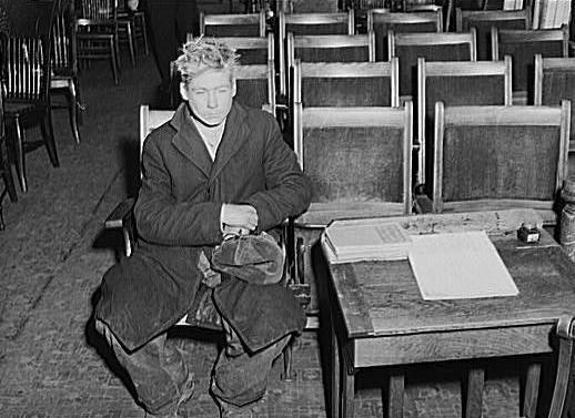 Great Depression: Young boy waiting to see if he can get a place to sleep for the night. City mission, Dubuque, Iowa. Photo by John Vachon Courtesy Library of Congress, Prints & Photographs Division, FSA-OWI Collection LC-USF34- 060566-D